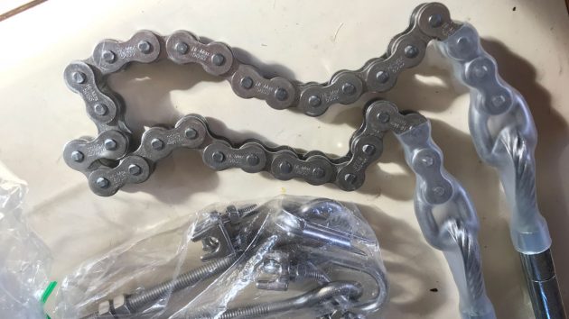 A boat steering chain and cable