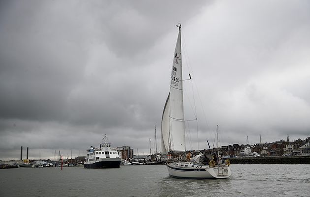 A yacht manoeuvring under sail
