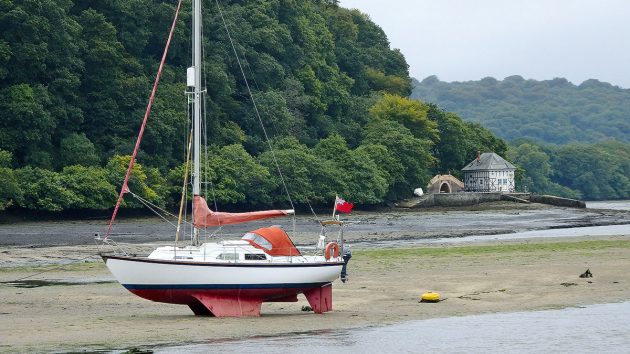 A boat dried out in an estuary