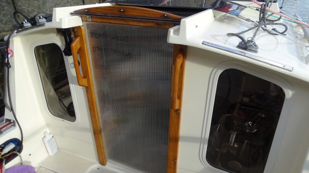 Made from polycarbonate roofing material, the new companionway lets in more light down below. Credit: John Willis