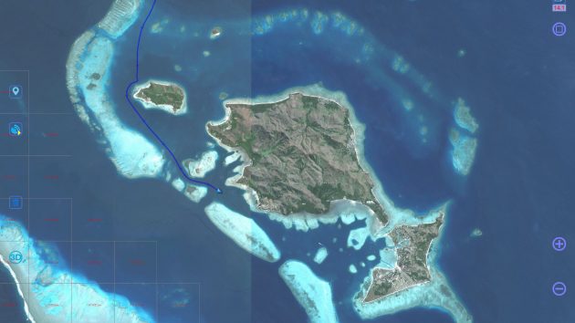 A satellite image of an island with some reefs; useful for boat navigation